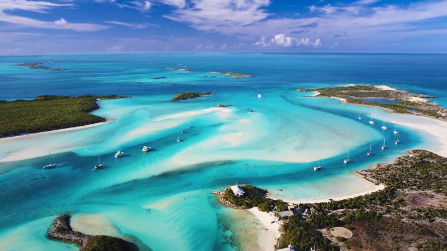 A sandbar in the Exumas, white sand and water in six shades of blue