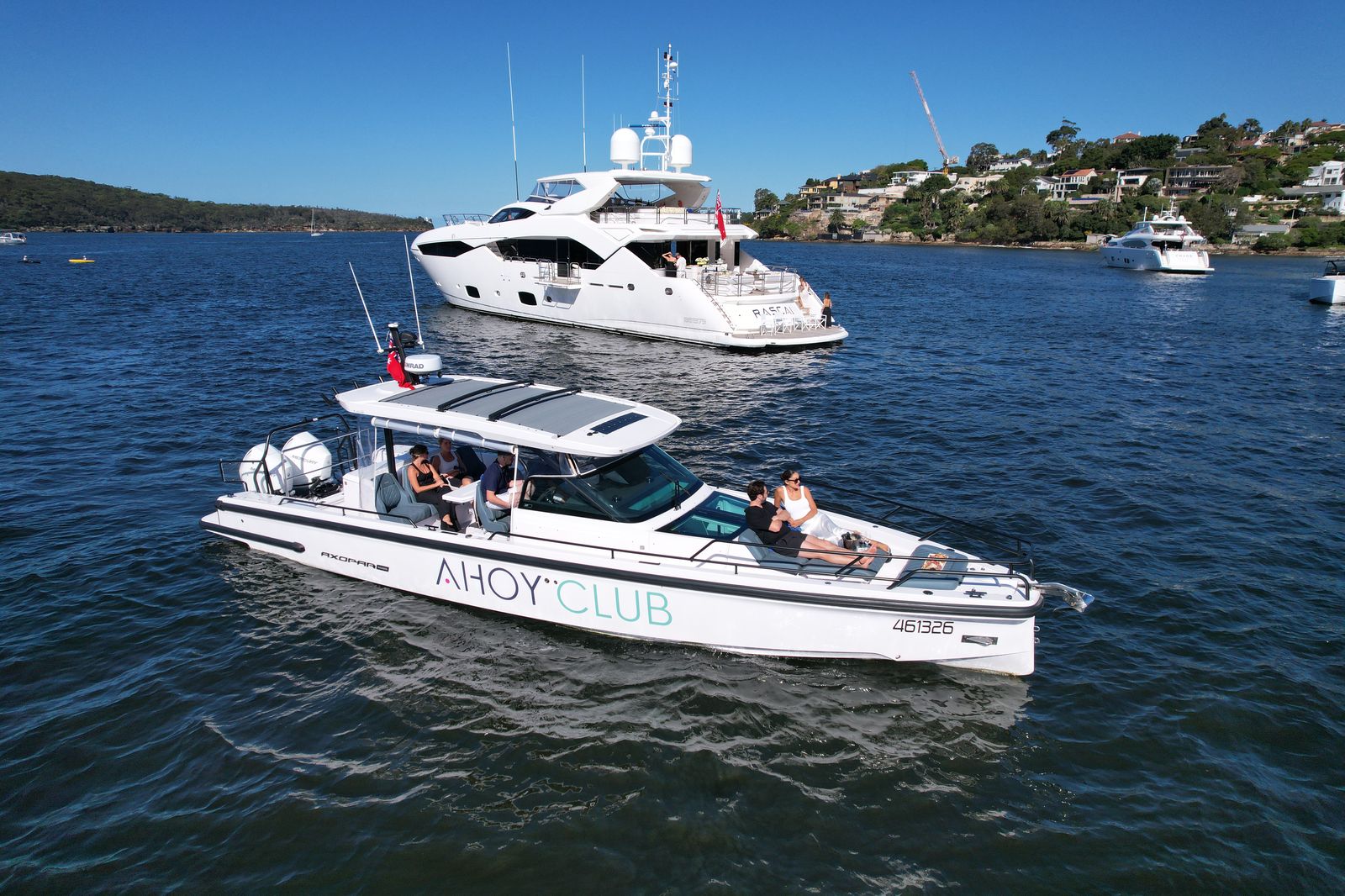 Guests swimming off a day boat in clear water
